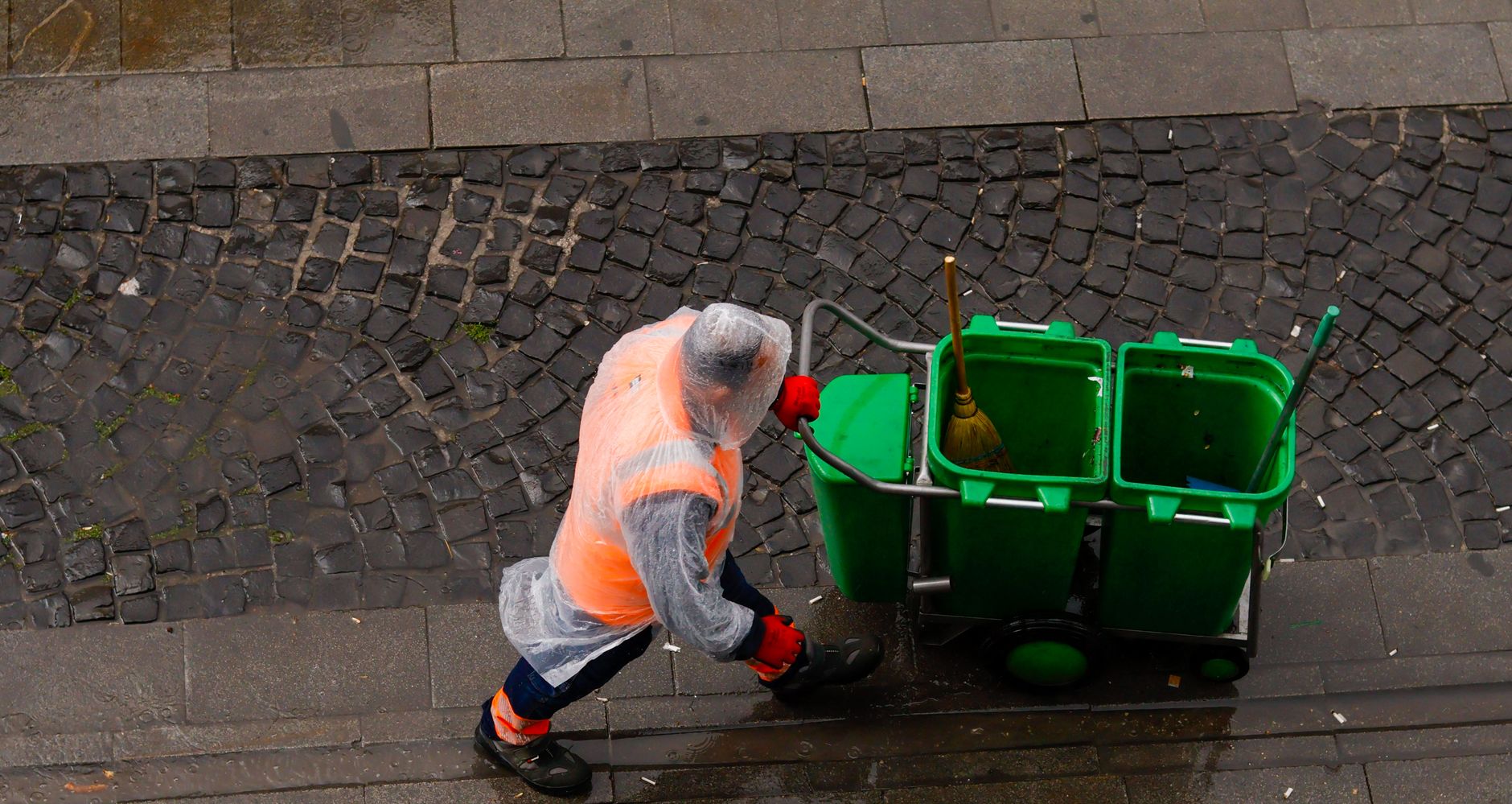 Image illustrating: Leuven city-cleaning workers in a municipal depot or street-cleaning setting, wi (editorial)